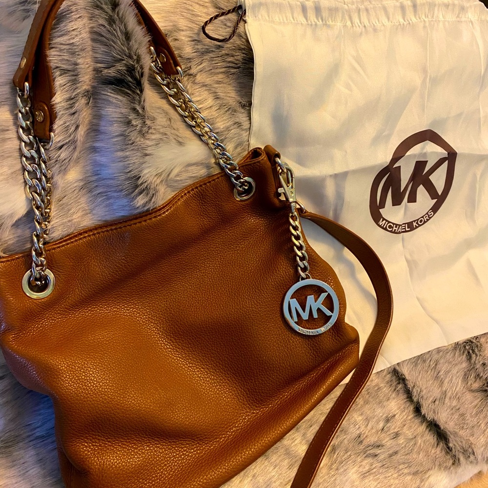 Michael Kors cross body / shoulder purse. Light brown in color
